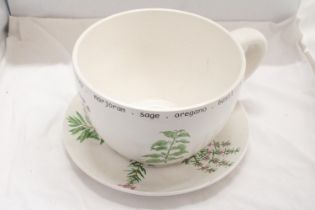 A LARGE CERAMIC, CUP AND SAUCER PLANTER WITH HERB DECORATION, HEIGHT 18CM, DIAMETER 26CM