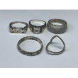 FIVE SILVER RINGS