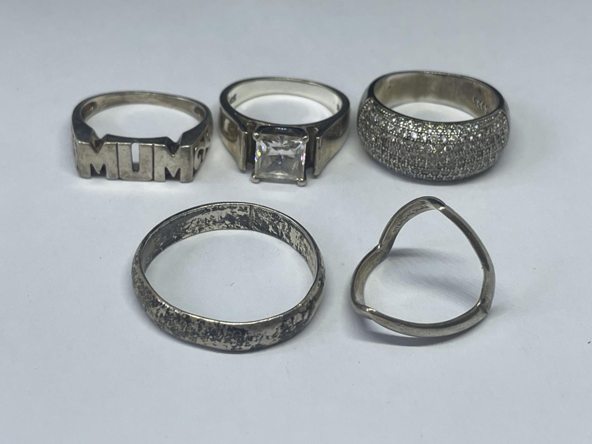 FIVE SILVER RINGS