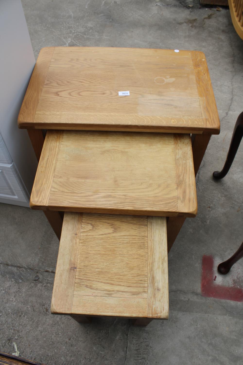 A MODERN OAK NEST OF THREE TABLES - Image 2 of 3