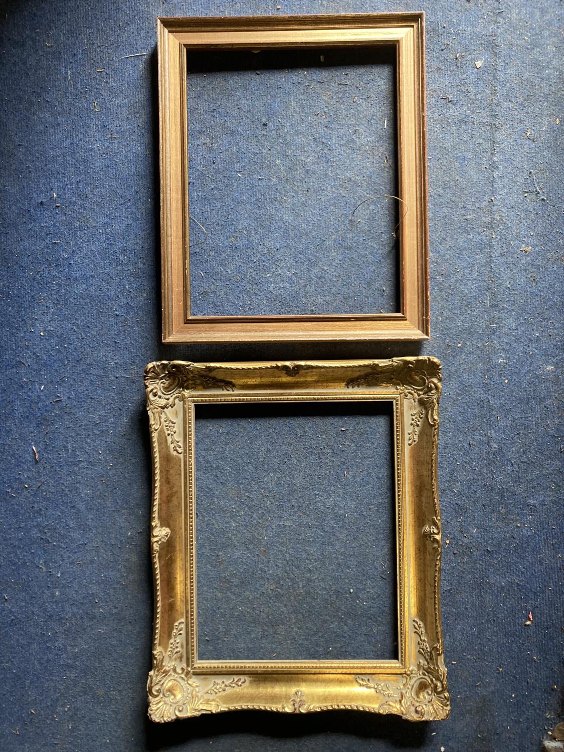 TWO PICTURE FRAMES TO INCLUDE AN ORNATE GILD AND A WOODEN ONE