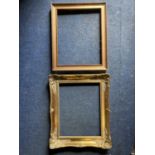 TWO PICTURE FRAMES TO INCLUDE AN ORNATE GILD AND A WOODEN ONE