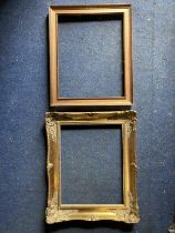 TWO PICTURE FRAMES TO INCLUDE AN ORNATE GILD AND A WOODEN ONE