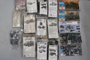 A LARGE COLLECTION OF BOXED MILITARY VEHICLES AND EQUIPMENT TO INCLUDE HASEGAWA
