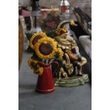 TWO CAST DOORSTOPS, A MR PUNCH AND SUNFLOWERS