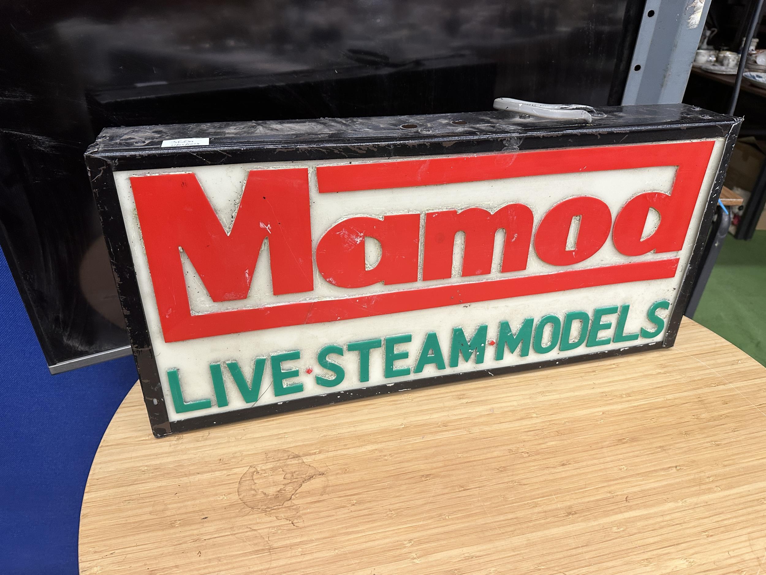 AN ILLUMINATED MAMOD LIVE STEAM MODELS SIGN (L:64.5CM H:30CM)