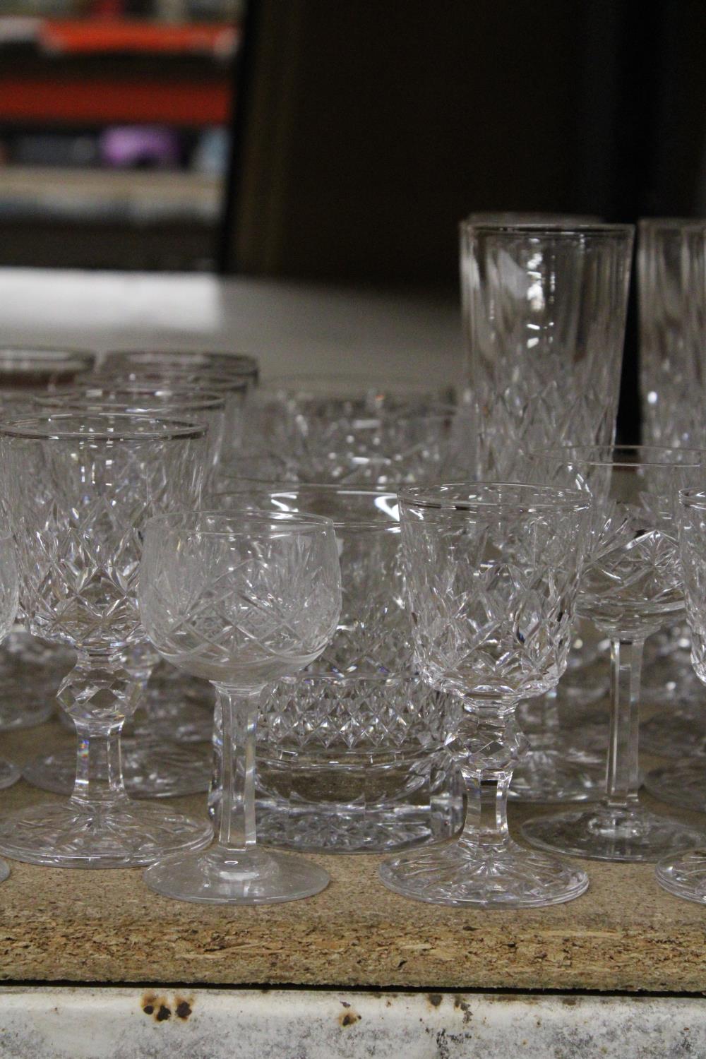 A QUANTITY OF CUT GLASS GLASSES TO INCLUDE CHAMPAGNE FLUTES, WHISKY, WINE, SHERRY, PORT, ETC - Image 4 of 5