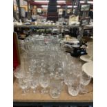 A QUANTITY OF GLASSES TO INCLUDE WINE, SHERRY, TUMBLERS, ETC