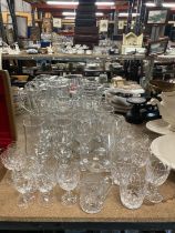 A QUANTITY OF GLASSES TO INCLUDE WINE, SHERRY, TUMBLERS, ETC