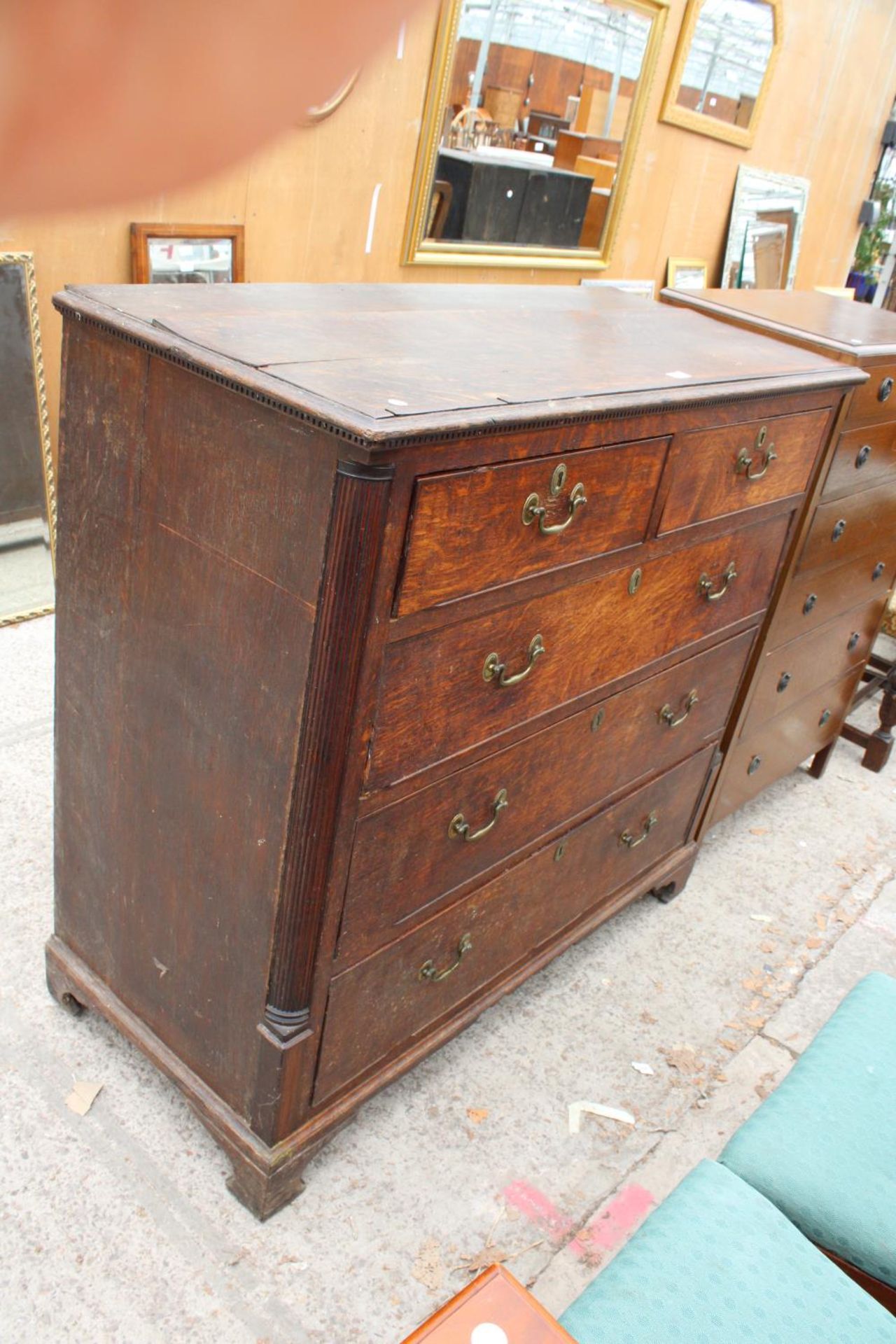 A GEORGE III OAK CHEST OF TWO SHORT AND THREE LONG GRADUATED DRAWERS, 48" WIDE