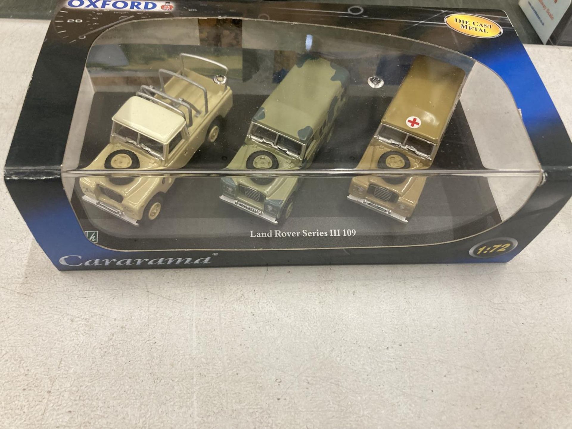 FOUR BOXED OXFORD MILITARY SERIES VEHICLES TO INCLUDE TWO WITH THREE LAND ROVERS IN EACH - Image 2 of 5