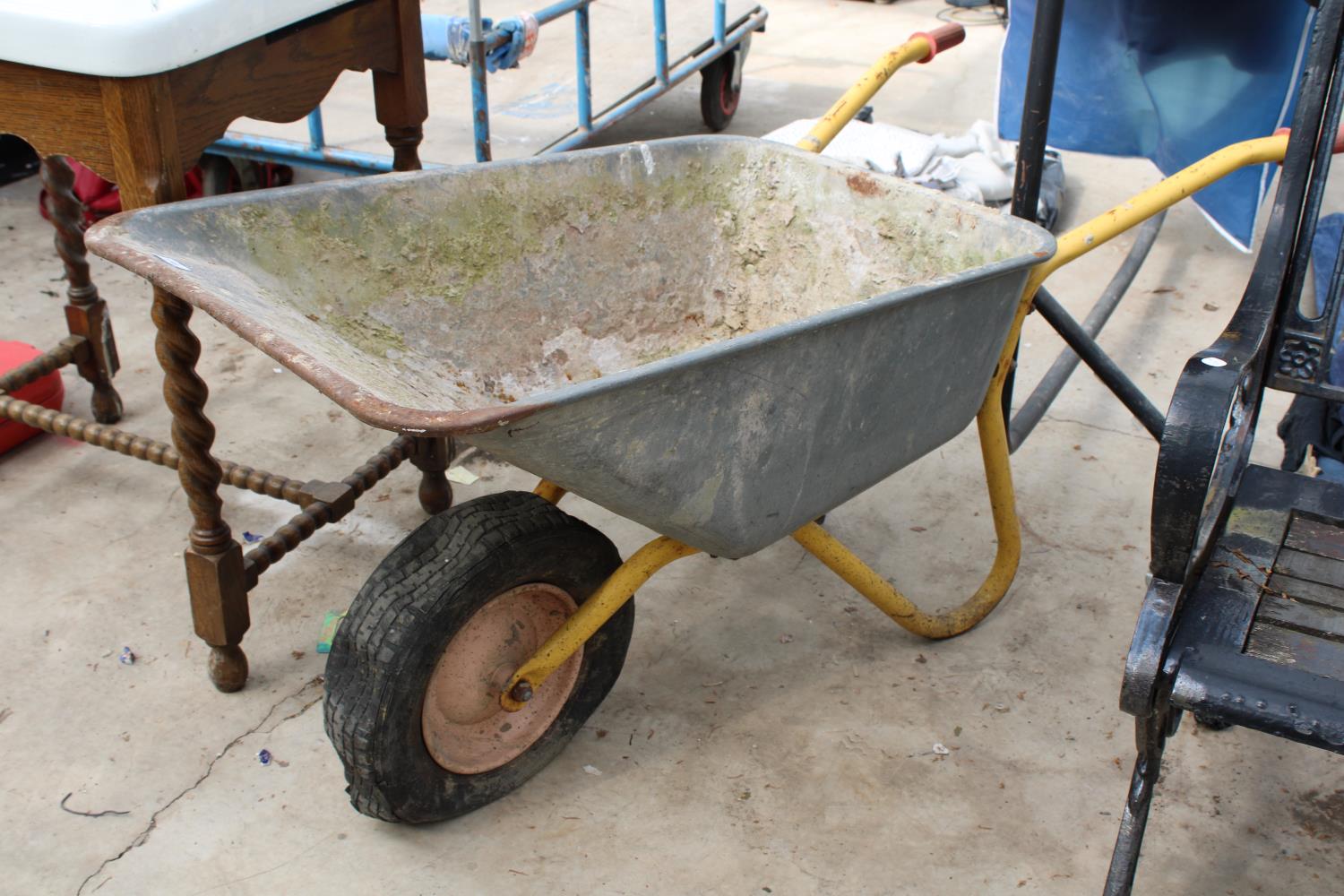 A LARGE METAL WHEEL BARROW WITH RUBBER TYRE