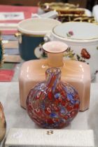 A PEACH GLASS BOTTLE VASE AND A MILLIFIORE VASE - POSSIBLY MURANO