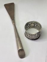 A HALLMARKED BIRMINGHAM SILVER HANDLED SHOE HORN AND AN ORIENTAL SILVER NAPKIN RING