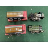 TWO HORNBY 'O' GUAGE LOCOMOTIVES WITH A PAIR OF TIN PLATE HORNBY O GAUGE CARRIAGES, BOXED