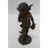 A BRONZE SCULPTURE OF A CHERUB SIGNED TO THE BASE