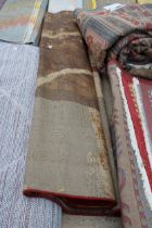 A BELIEVED AS NEW MADE IN TURKEY MULTICOLOURED PATTERNED RUG (215CM X 305CM)