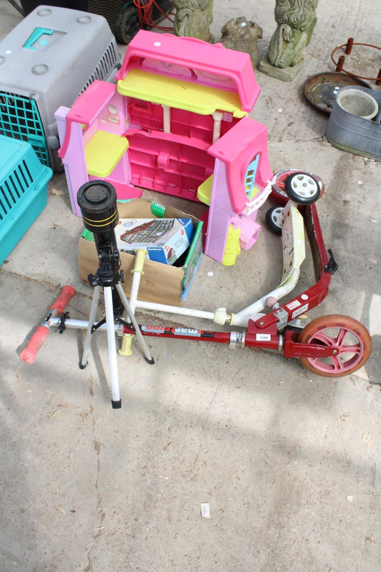 AN ASSORTMENT OF CHILDRENS TOYS AND GAMES TO INCLUDE TWO SCOOTERS AND A JIGSAW PUZZLE ETC