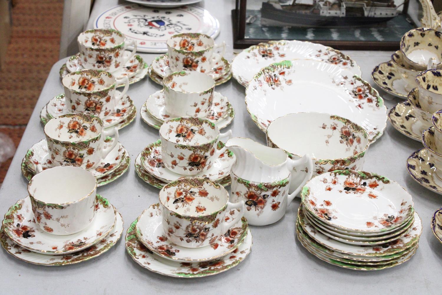A ROYAL ALBERT CROWN CHINA "POPPY" PART TEASET TO INCLUDE CUPS, SAUCERS, SIDE PLATES AND SUGAR