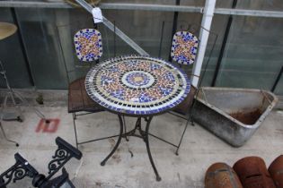 A METAL TILE TOPPED BISTRO TABLE AND A PAIR OF FOLDING CHAIRS TO MATCH