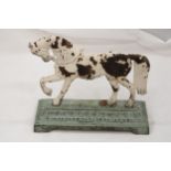 A VICTORIAN CAST IRON HORSE DOOR STOP ON GREEN BASE - APPROXIMATELY 23CM X 23CM