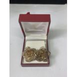 A PAIR OF SILVER EARRINGS IN A PRESENTATION BOX