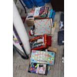 AN ASSORTMENT OF ITEMS TO INCLUDE A BOXED HORNBY CLOCKWORK TRAIN SET, BOOKS AND BOARD GAMES ETC