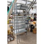 A METAL SHELVING UNIT WITH TWO SPARE UPRIGHTS, SEVEN EXTRA SHELVES AND BRACKETS ETC