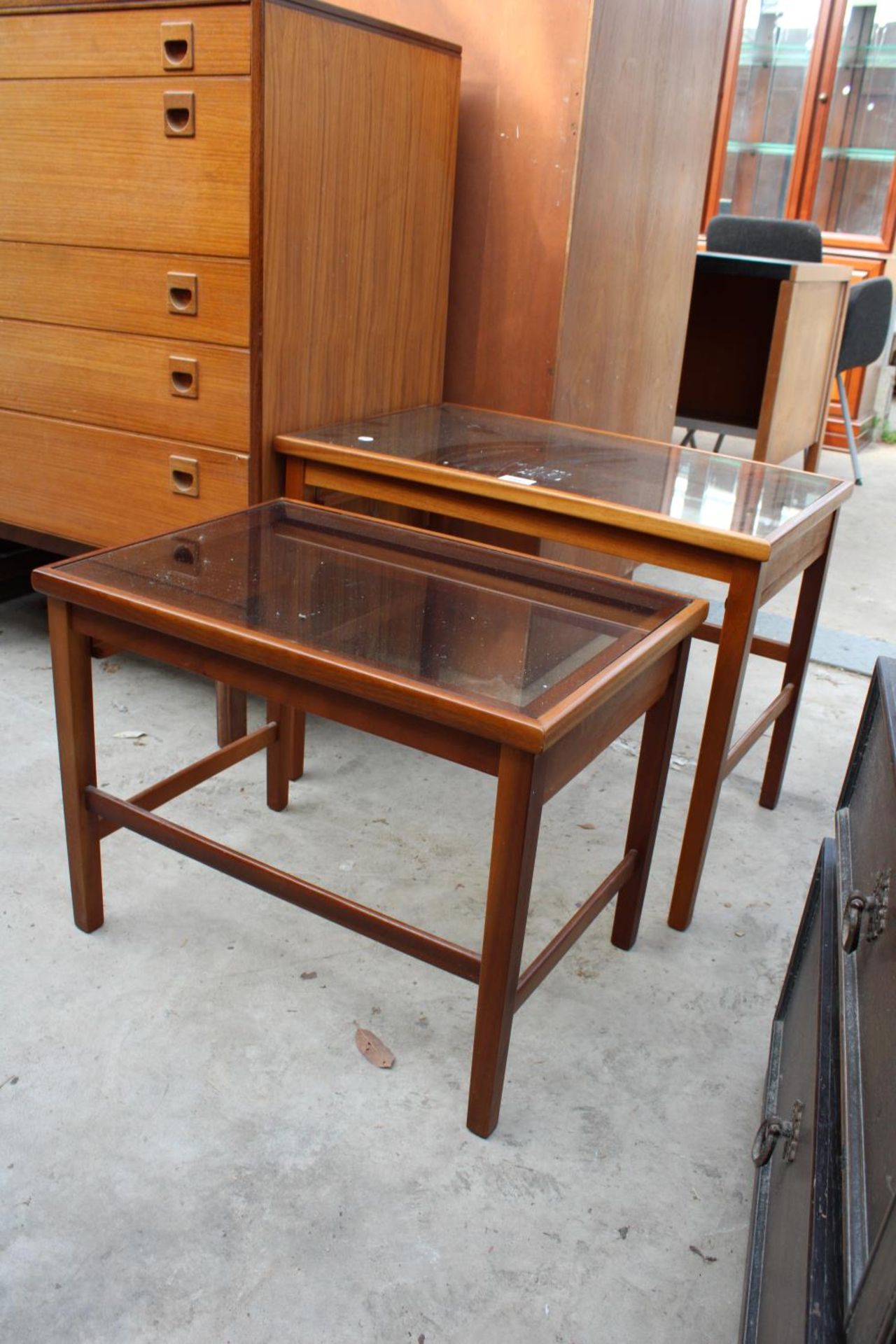 A RETRO TEAK NEST OF TWO TABLES WITH INSET GLASS TOPS - Image 2 of 3