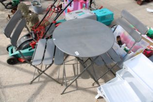 A METAL FOLDING BISTRO TABLE AND TWO CHAIRS
