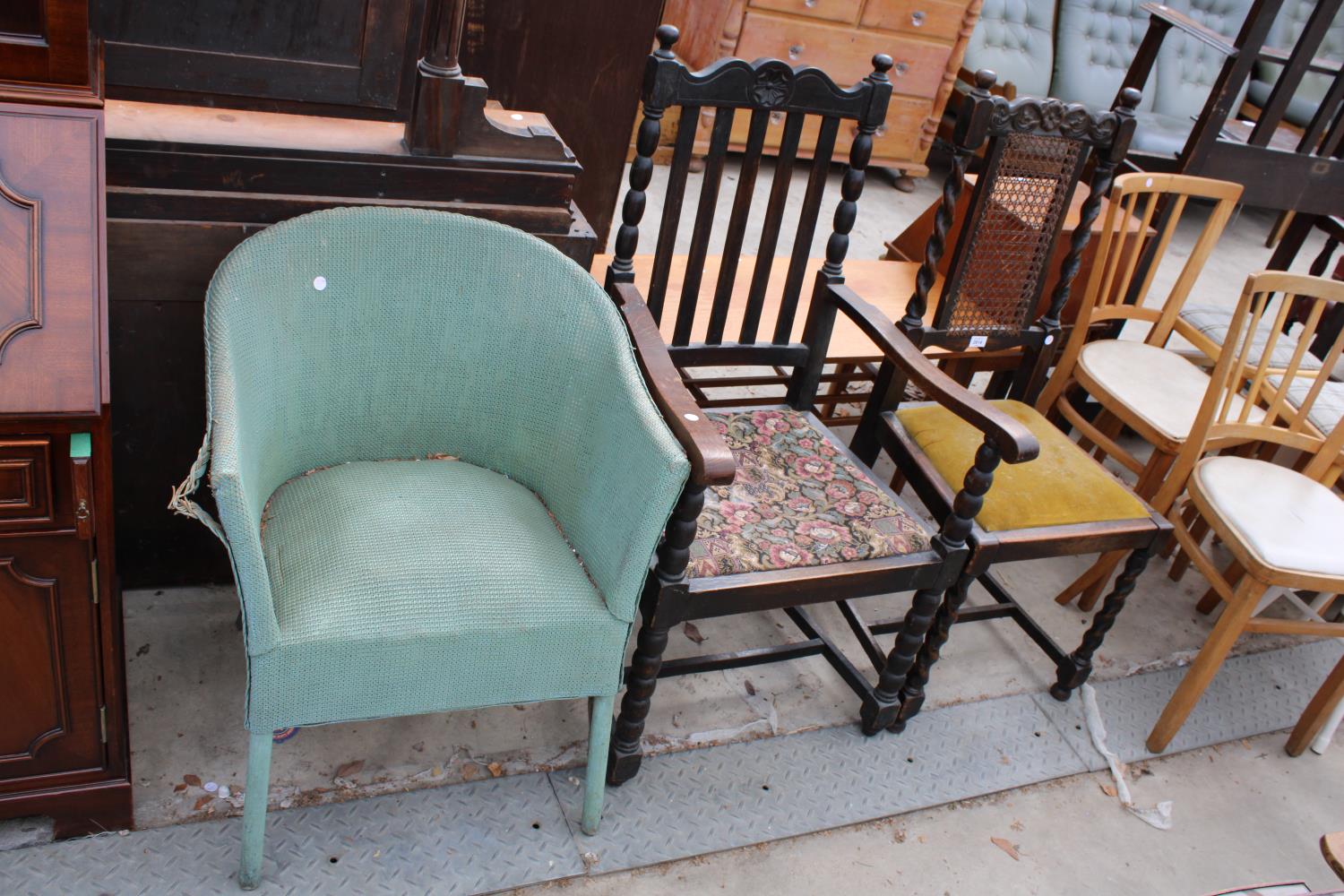 AN EARLY 20TH CENTURY OAK CARVER CHAIR, SIMILAR DINING CHAIR AND A LLOYD LOOM STYLE BEDROOM CHAIR