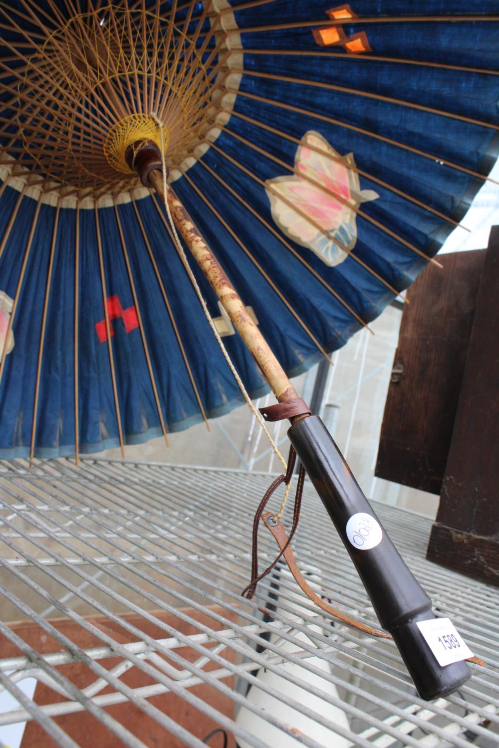 A VINTAGE ORIENTAL PARASOL