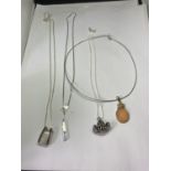 FOUR SILVER NECKLACES WITH PENDANTS