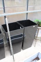 A PAIR OF TALL BLACK PLASTIC SQUARE PLANTERS (H:76CM W:40CM)