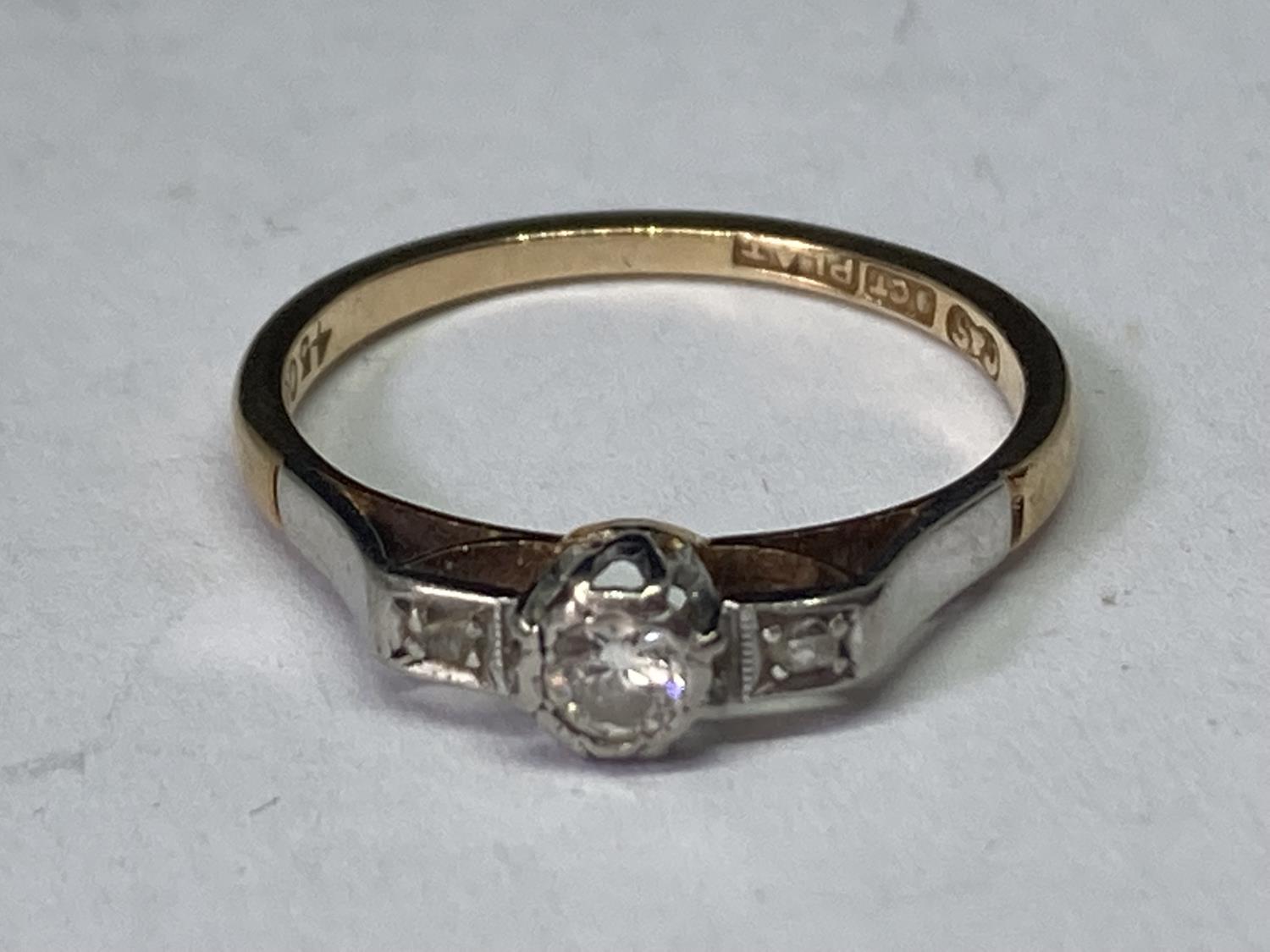 A 9 CARAT GOLD RING WITH DIAMONDS SIZE K/L