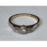 A 9 CARAT GOLD RING WITH DIAMONDS SIZE K/L