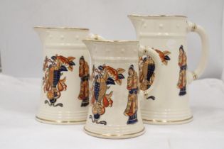 A SET OF THREE ORIENTAL STYLE JUGS - ALL WITH STAMPS TO BASE