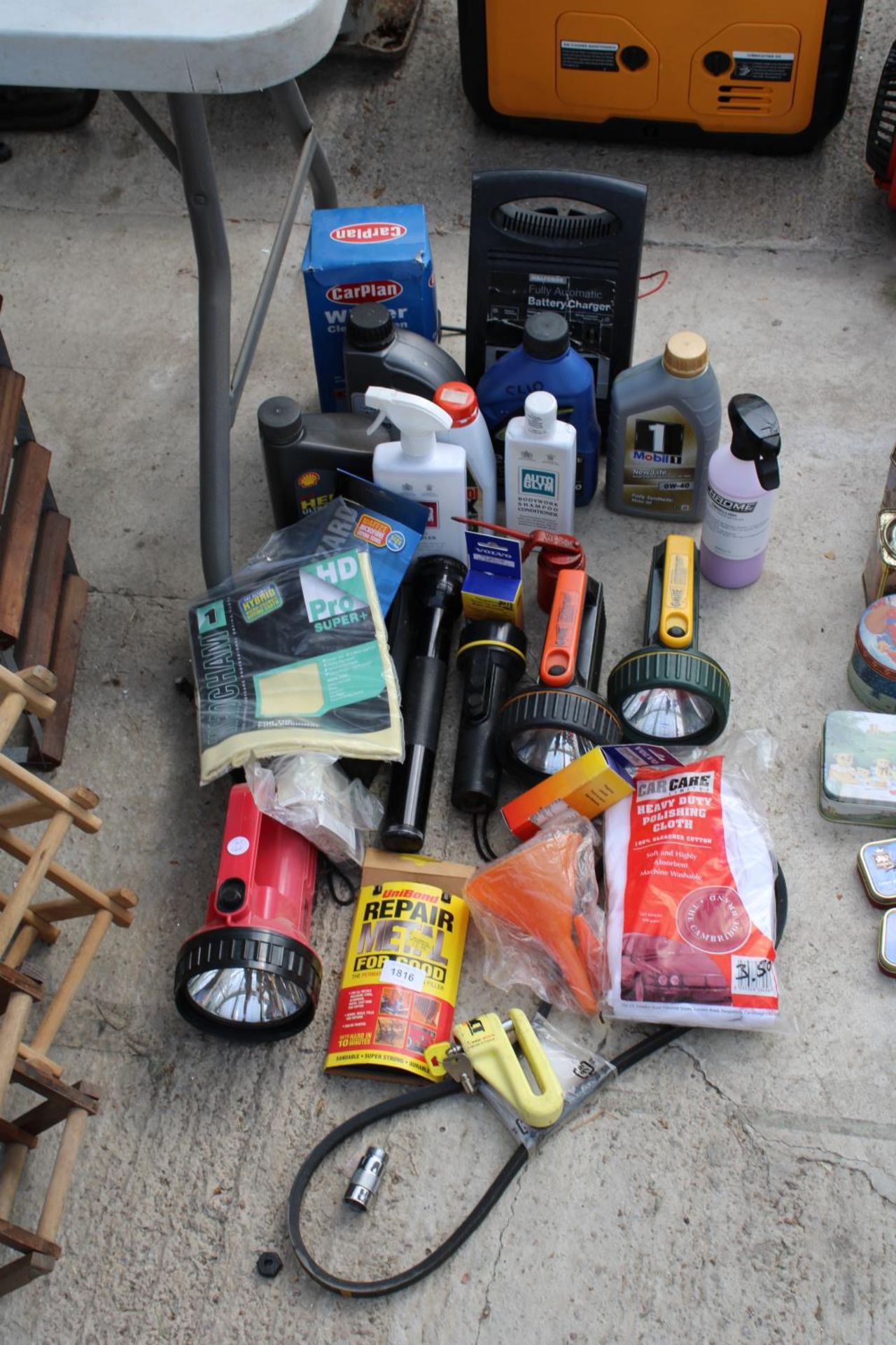 AN ASSORTMENT OF ITEMS TO INCLUDE TORCHES AND MOTOR OILS ETC