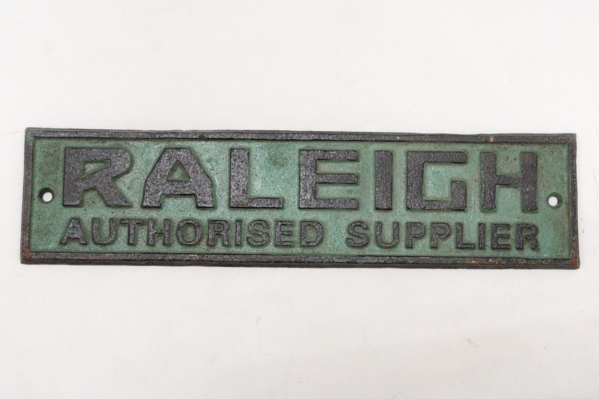 A CAST IRON RALEIGH AUTHORISED SUPPLIER SIGN