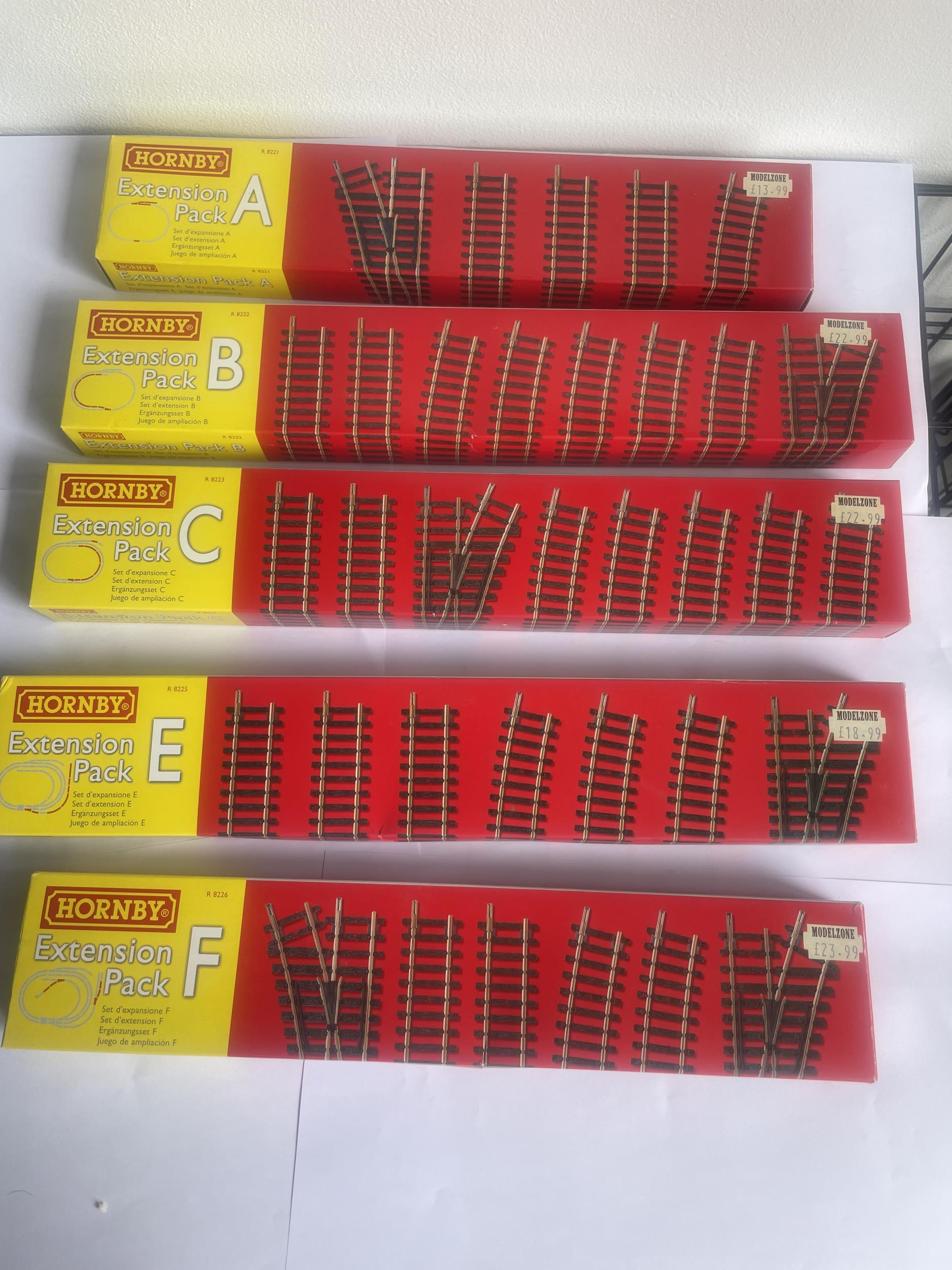 FIVE BOXED HORNBY 00 GAUGE TRACK EXTENSION PACKS TO INCLUDE A,B,C,E AND F
