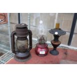 TWO VINTAGE DECORATIVE OIL LAMPS AND A LANTERN