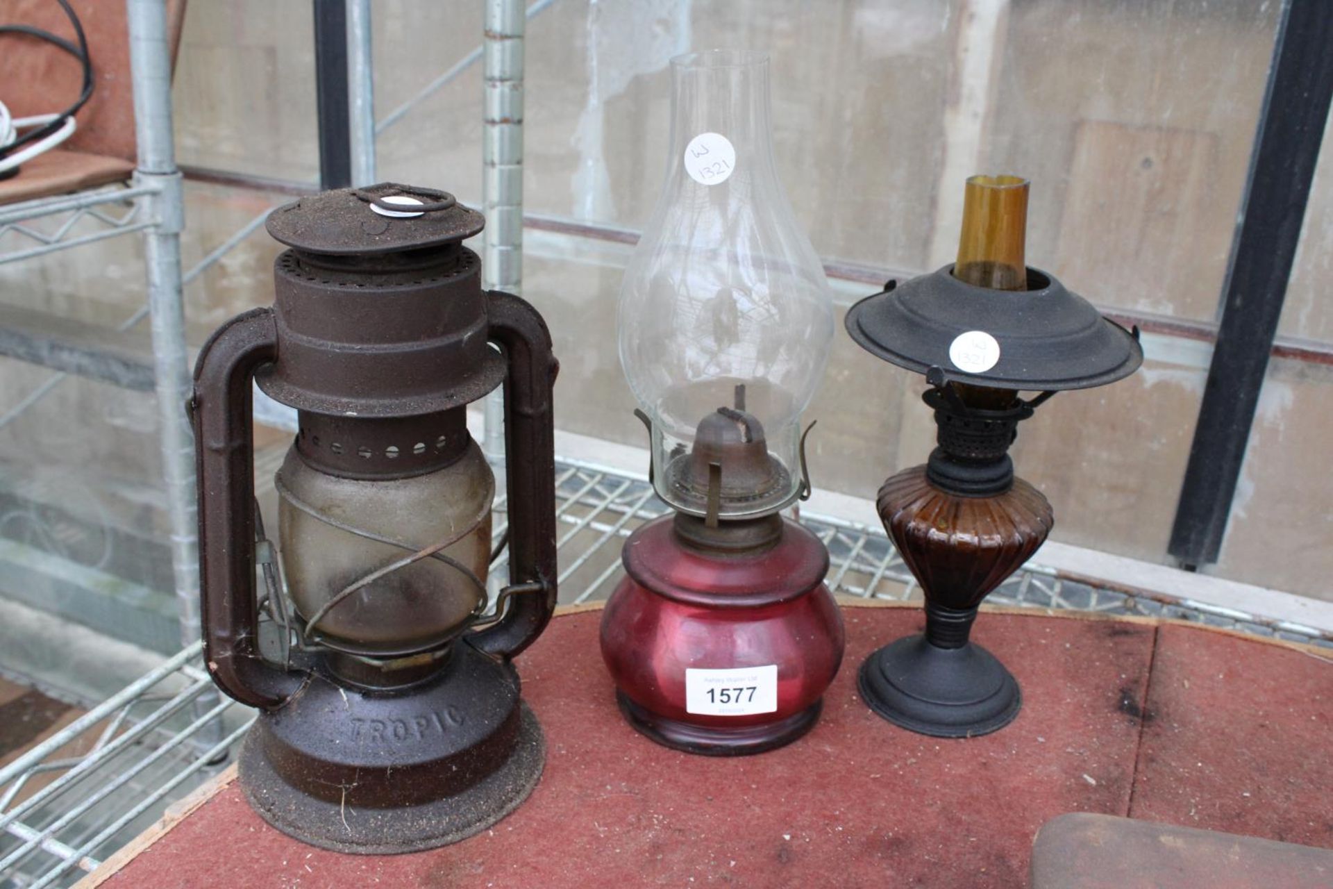 TWO VINTAGE DECORATIVE OIL LAMPS AND A LANTERN