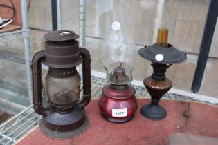 TWO VINTAGE DECORATIVE OIL LAMPS AND A LANTERN