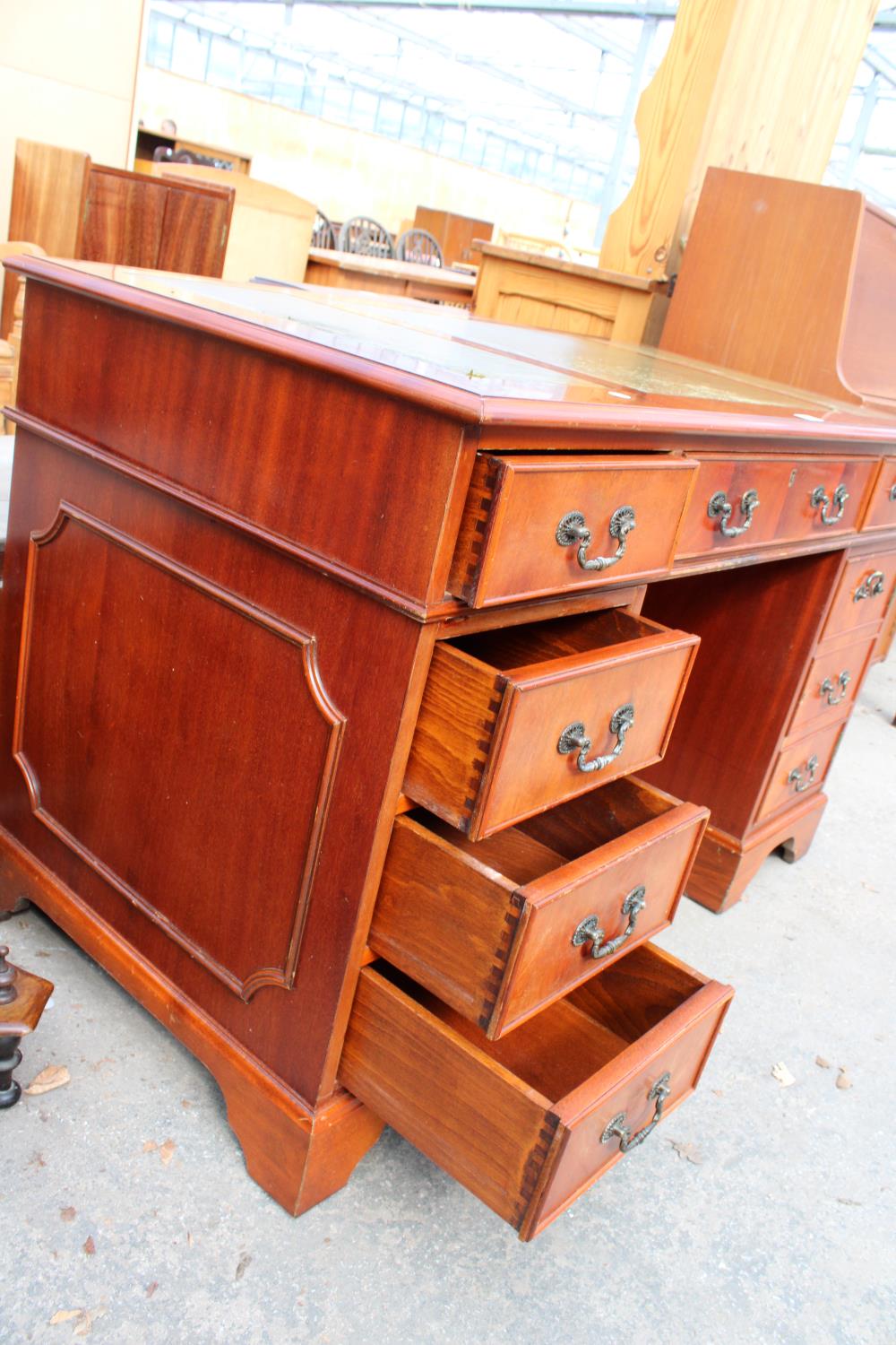 A MAHOGANY TWIN-PEDESTAL DESK ENCLOSING SIX DRAWERS AND ONE CUPBOARD WITH INSET LEATHER TOP, 48" X - Image 4 of 5