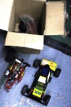 TWO LARGE REMOTE CONTROL RACING CARS AND SPARE TYRES, ETC FOR RESTORATION