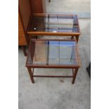 A RETRO TEAK NEST OF TWO TABLES WITH INSET GLASS TOPS