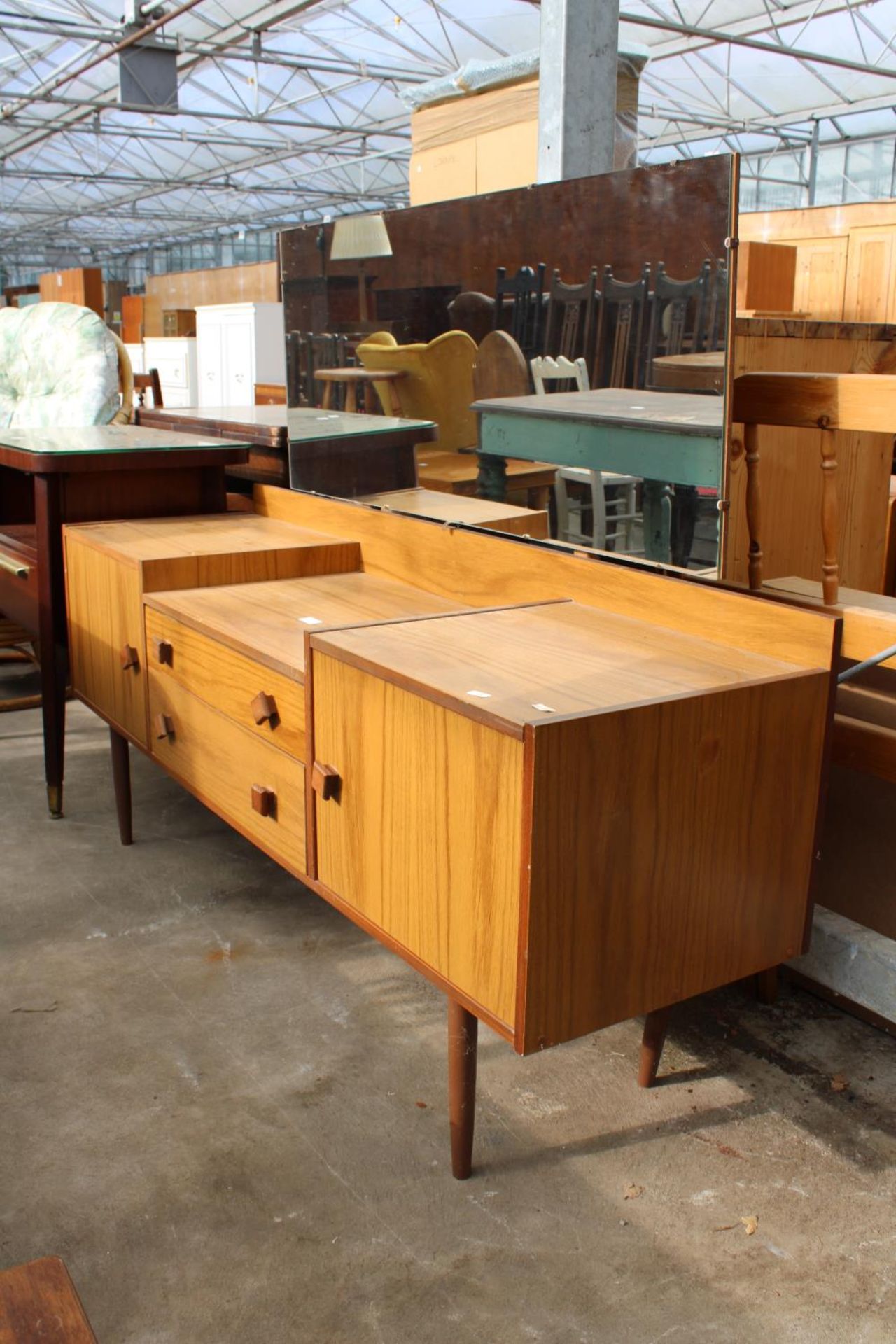 A RETRO TEAK LOW DRESSING TABLE ENCLOSING TWO DRAWERS AND TWO CUPBOARDS, 60" WIDE - Image 2 of 2