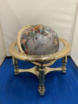 A SEMI PRECIOUS STONE GLOBE ON A BRASS STAND WITH COMPASS