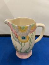 A CLARICE CLIFF NEWPORT POTTERY ATHENS JUG IN THE RHODANTHE PATTERN HAND PAINTED IN YELLOWS AND