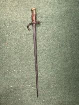 A VINTAGE BRASS AND WOOD BAYONET